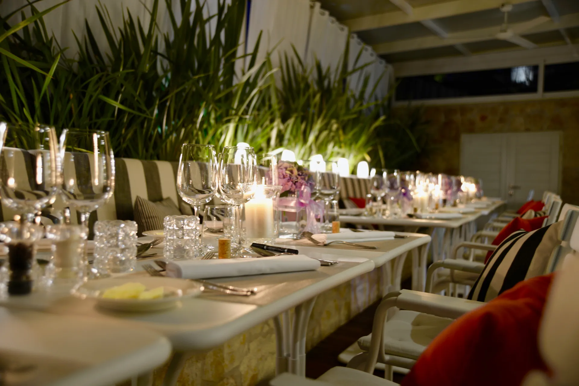 Long candlelit table set for a private dinner at Mimi's Bistro